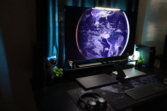 A computer desk with a monitor and keyboard