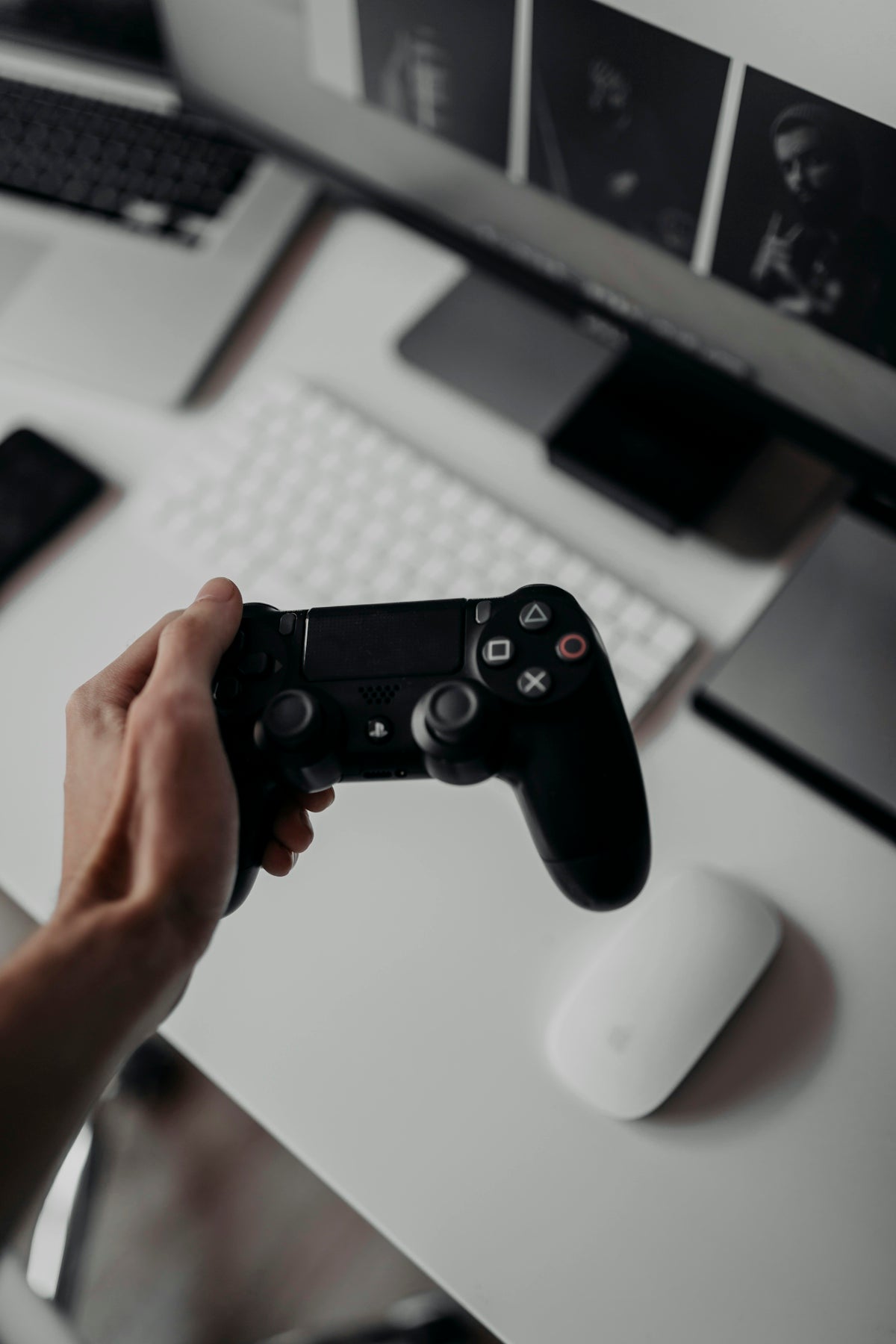 person holding Sony PlayStation Dualshock 4 controller