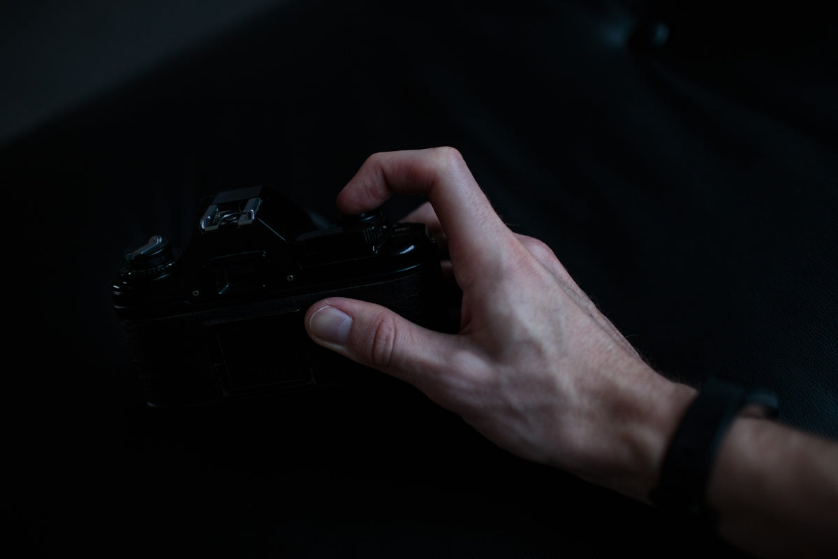 person holding black camera