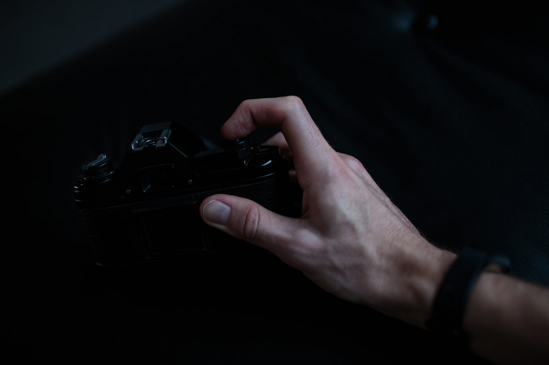 person holding black camera