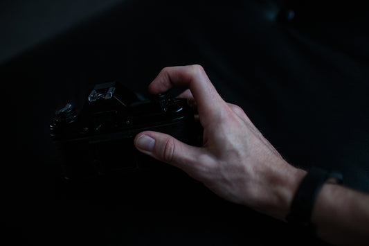 person holding black camera