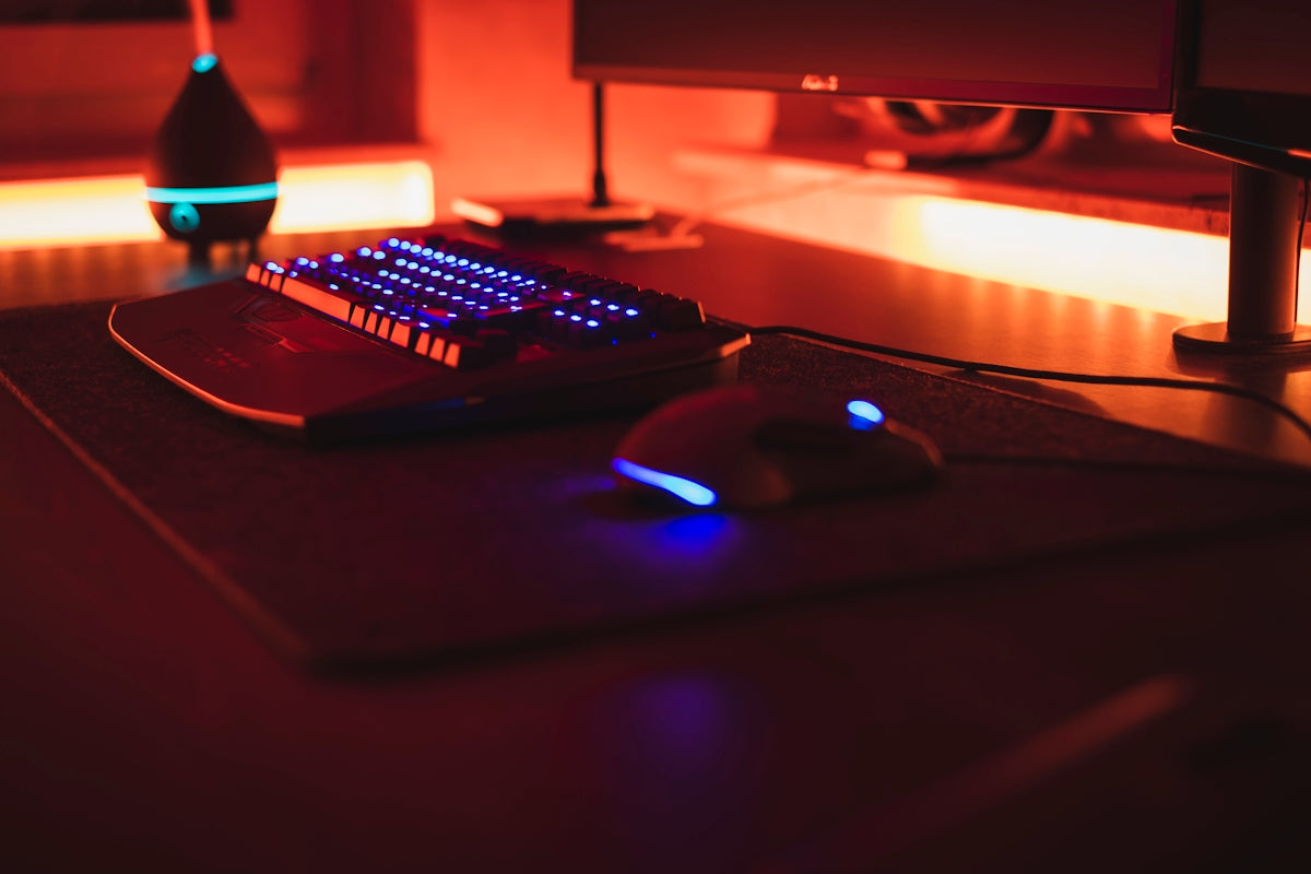 black computer keyboard beside black flat screen computer monitor