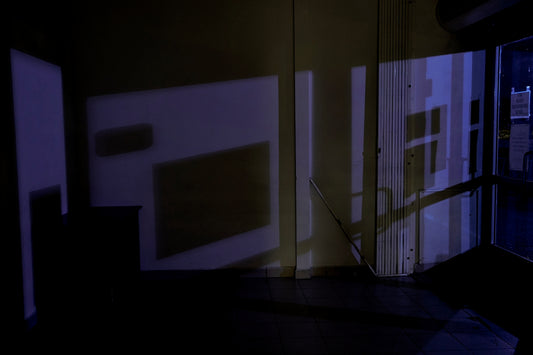 a shadow of a person standing in a room