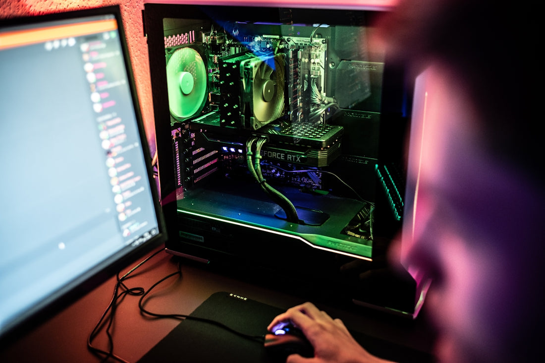 a person is working on a computer with a mouse