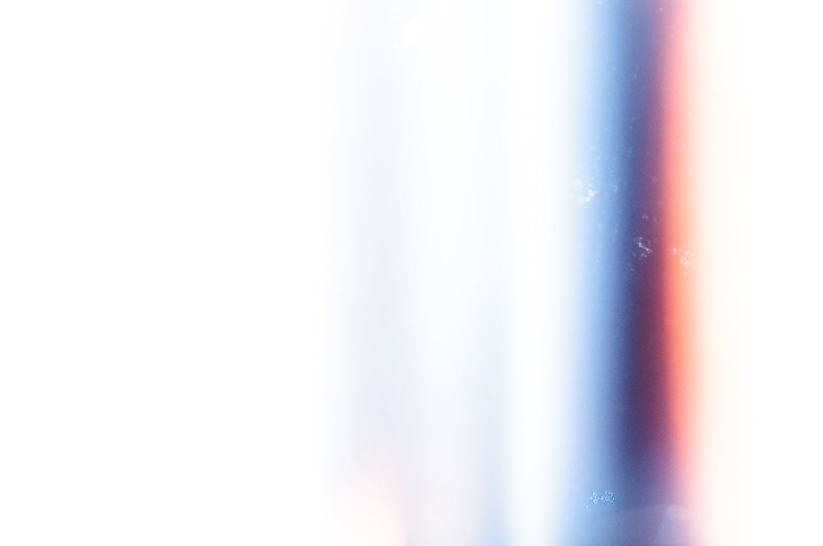 a blurry photo of a red, white and blue object