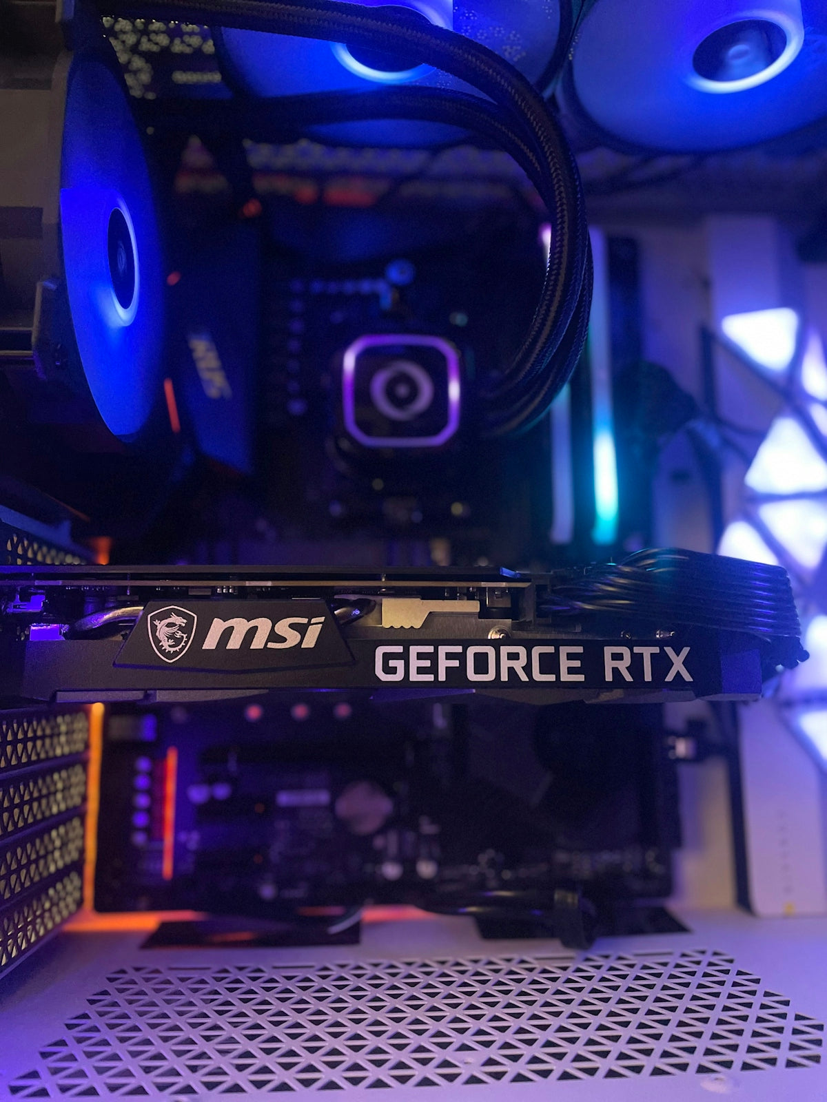 a close up of a computer tower with blue lights