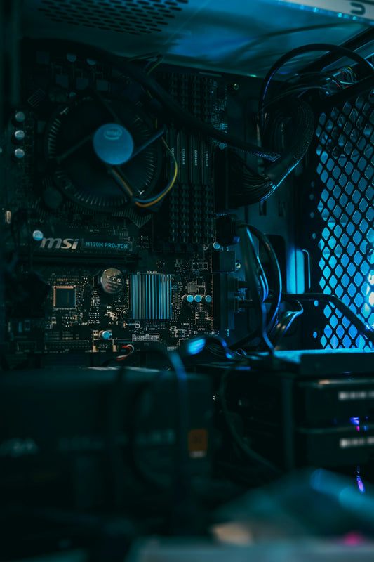 a close up of a computer motherboard with many wires