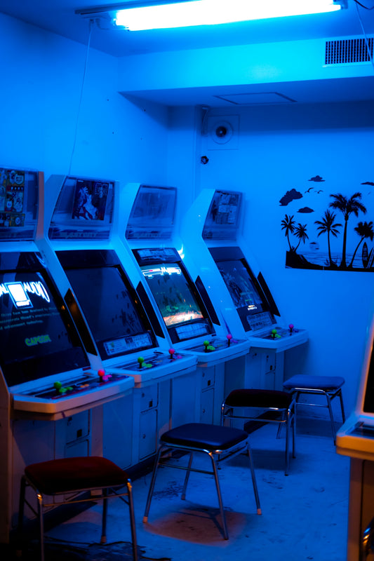 a room with a bunch of arcade machines in it