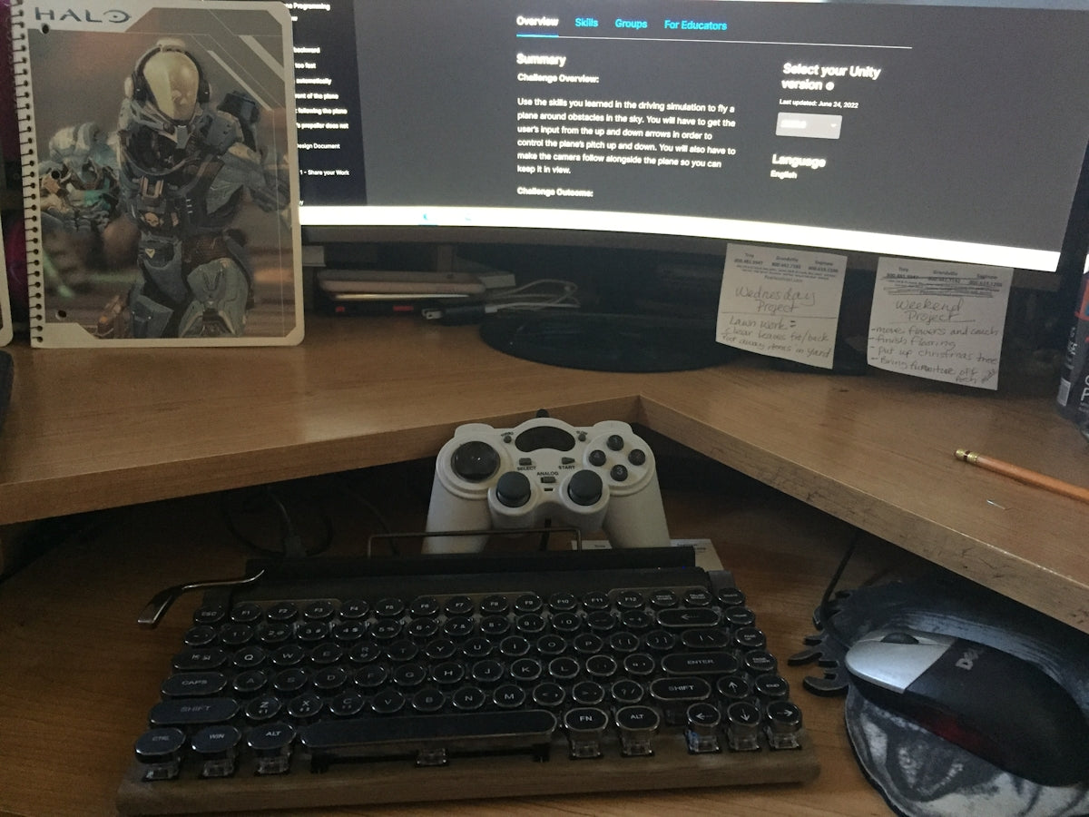 a computer desk with a keyboard and a monitor