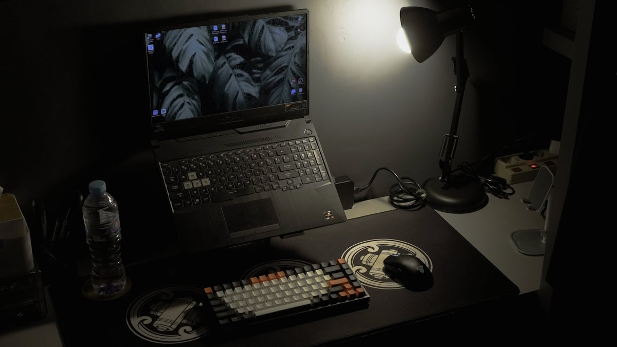 a laptop computer sitting on top of a desk