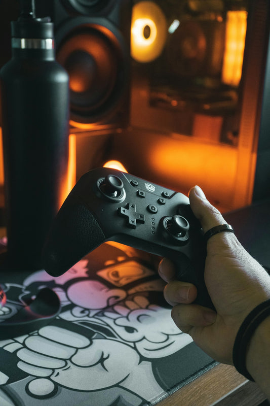 a person holding a remote control in their hand