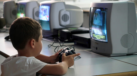 a young boy playing a video game on a nintendo wii