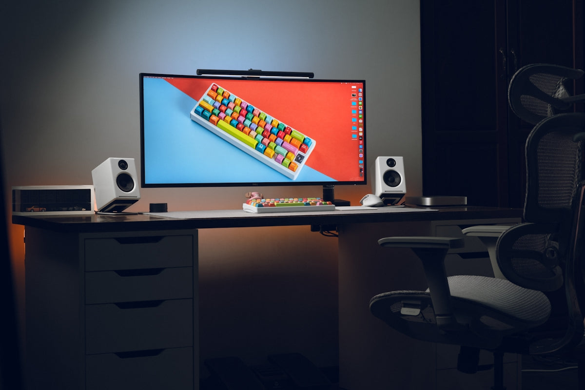 A computer monitor sitting on top of a desk