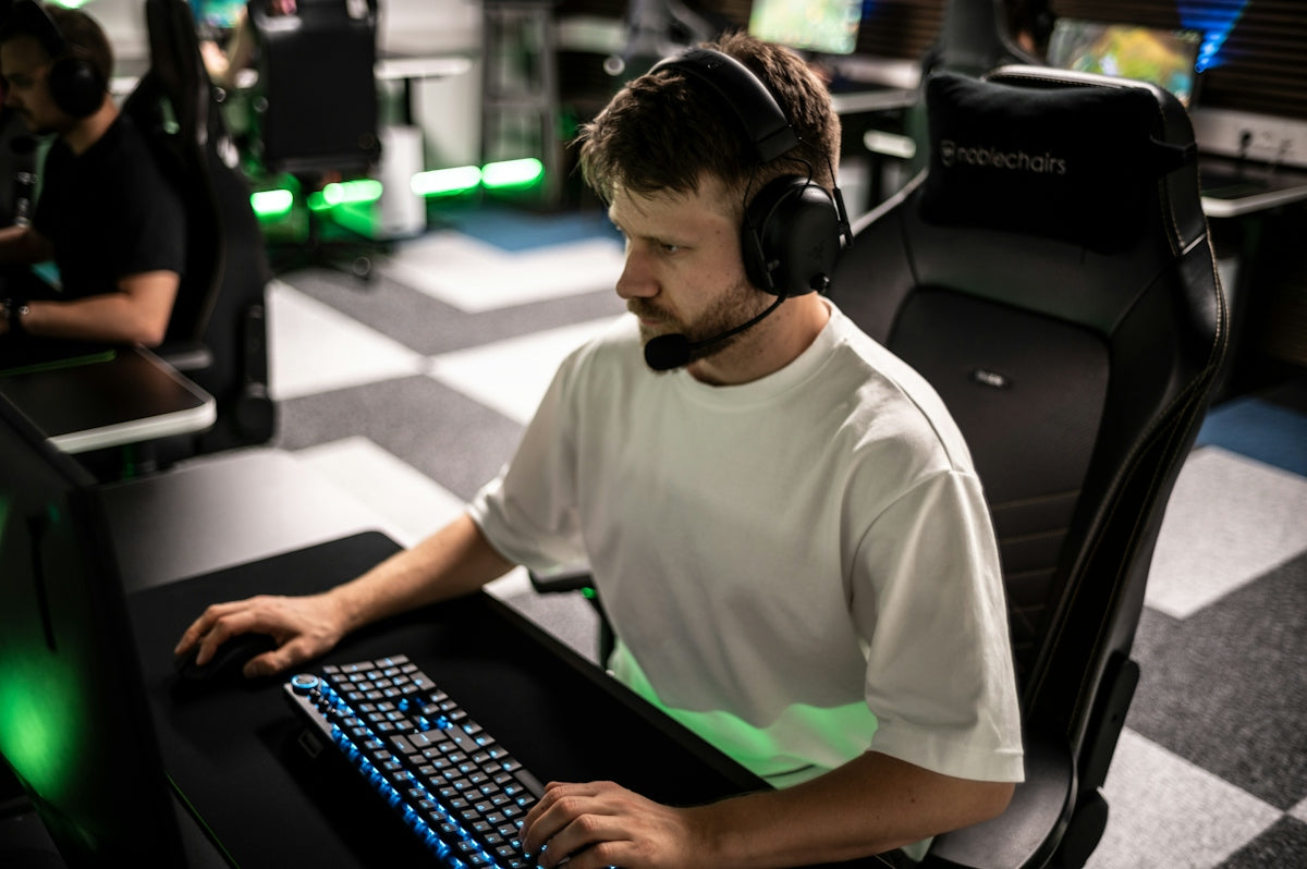 A man sitting in front of a computer keyboard