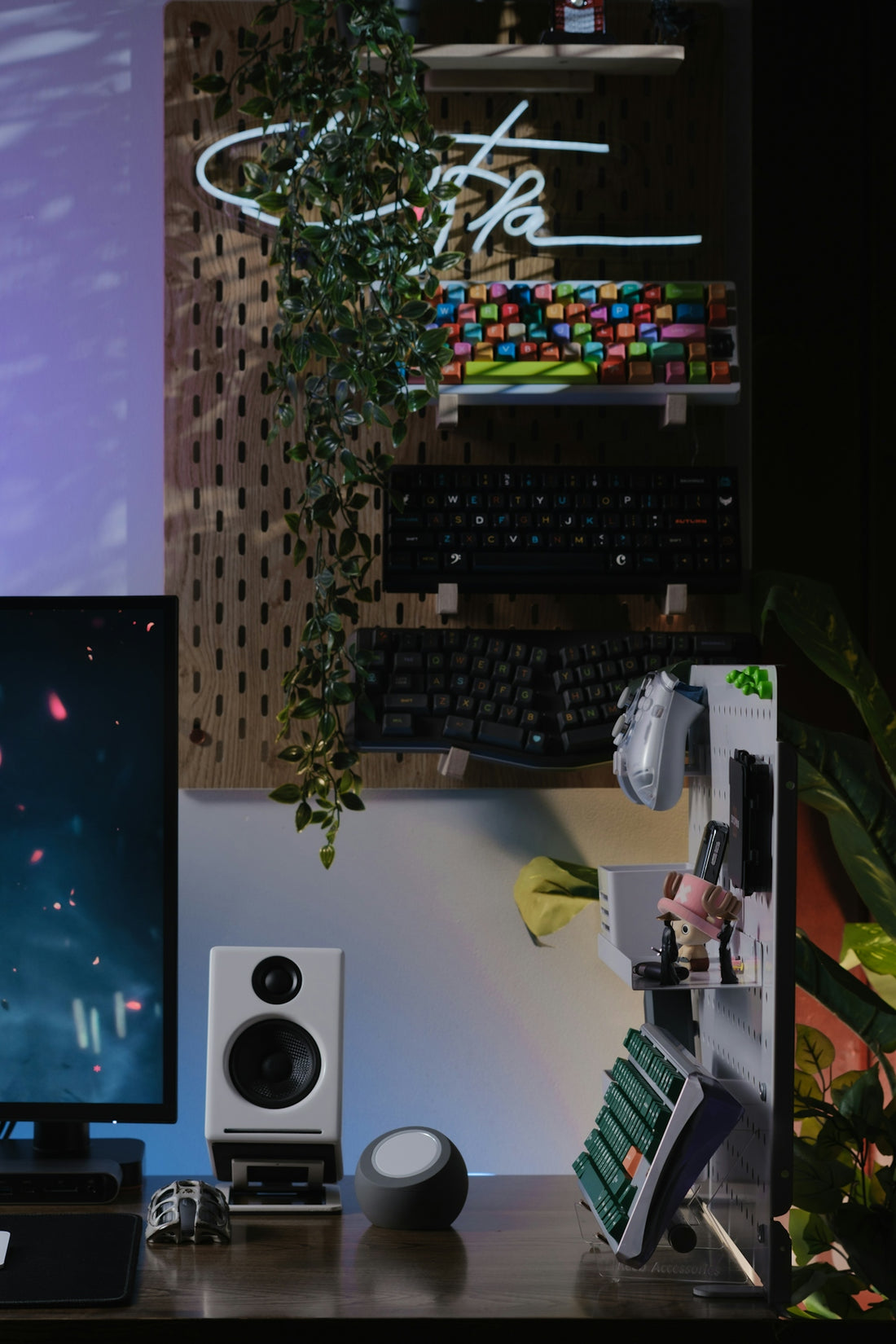 A desk with a computer and speakers on it