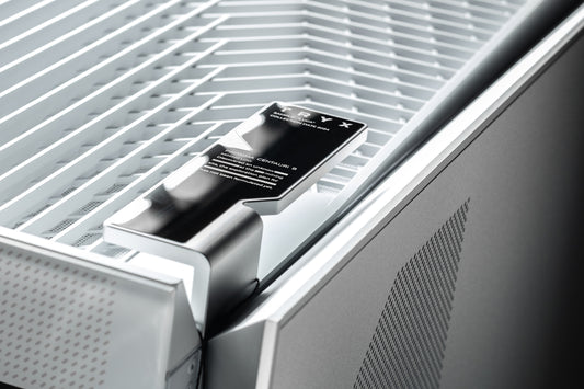 A close up of a metal door with a black handle