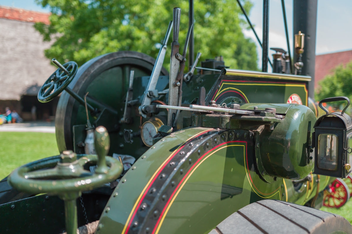 An antique steam tractor is pictured outdoors