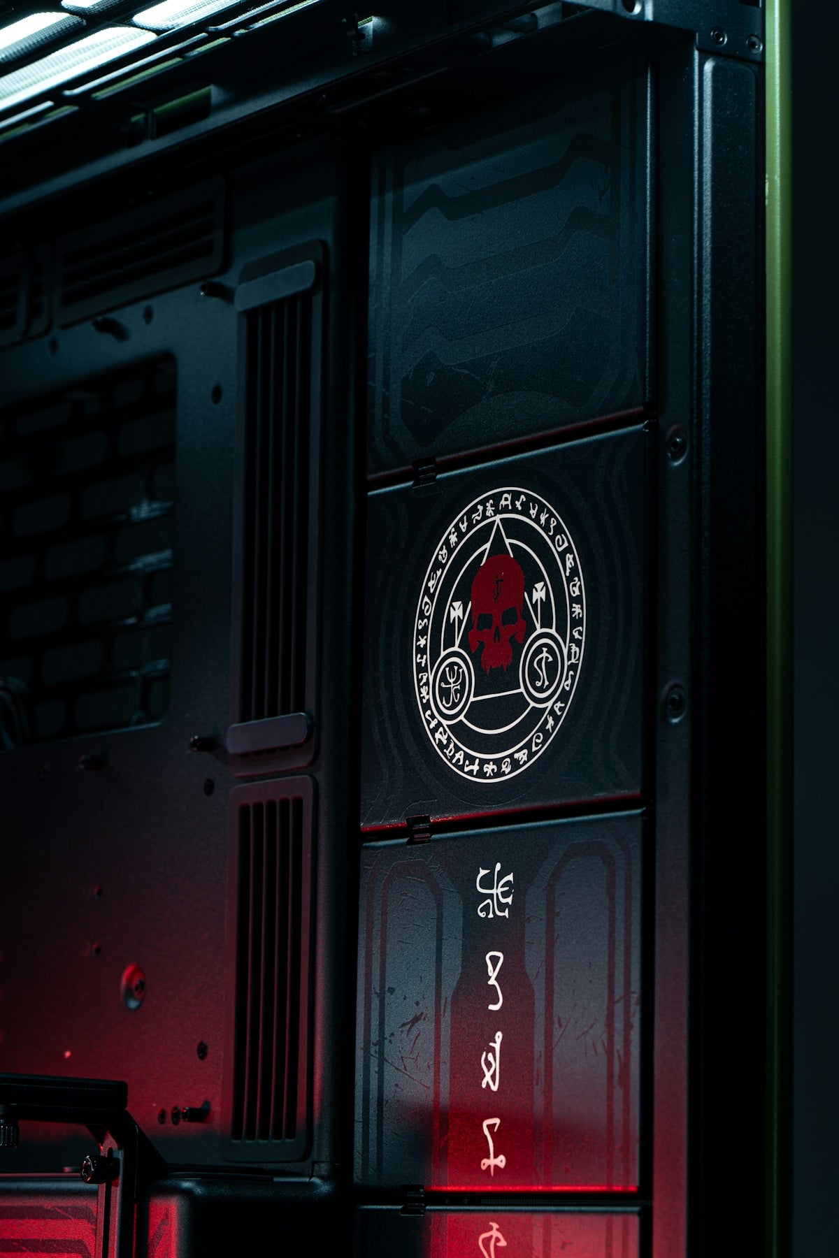 A dark computer case with occult symbols