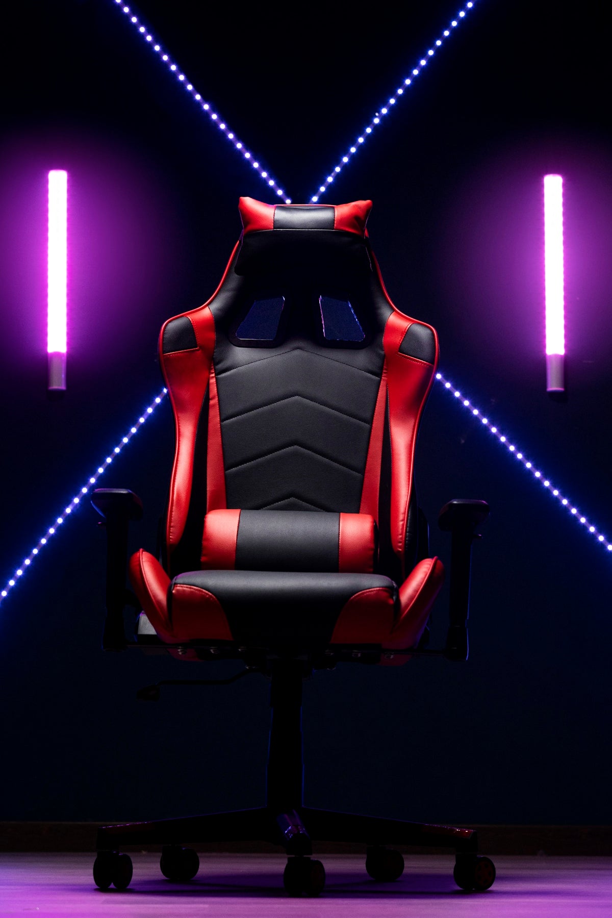 A red and black gaming chair with neon lights