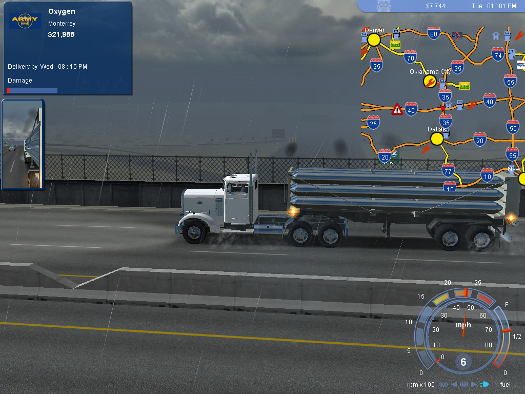 Experience the thrill of trucking in 18 Wheels of Steel Pedal to the Metal (2004) Microsoft Windows PC CD, navigating the rain.